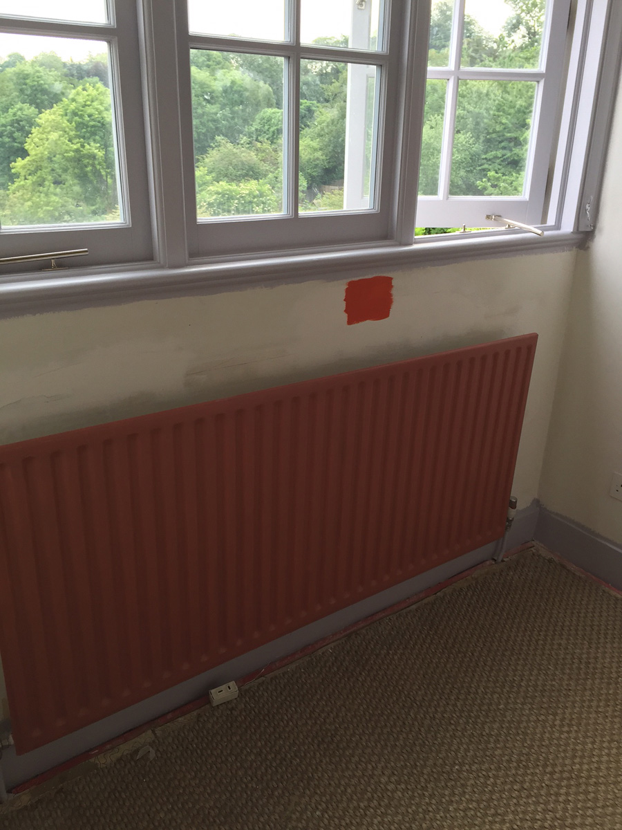 Remodelling project showing radiator and wall (before)
