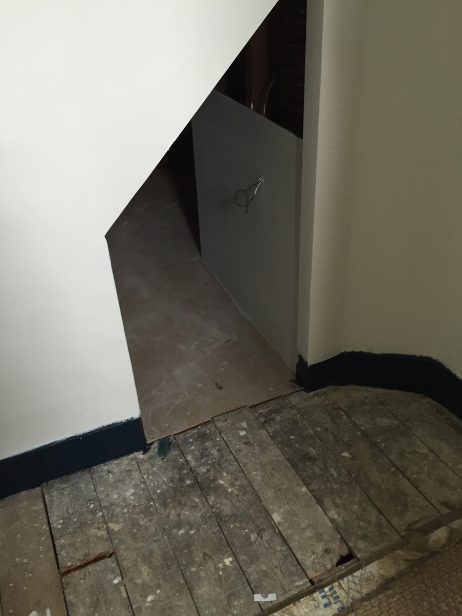 Remodelling project showing access hatch between two bedrooms (after painting)