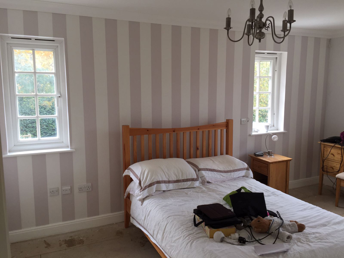 Bedroom after new wallpaper installed